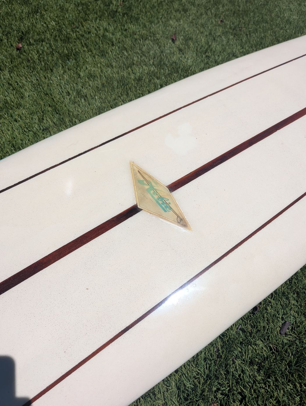 The saved Hobie logo laminate on the finished board