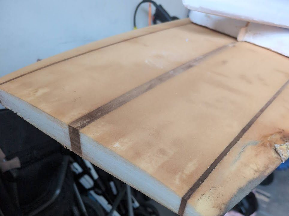 Hobie blank with ten inches of the nose cut off, showing clean foam and three stringers
