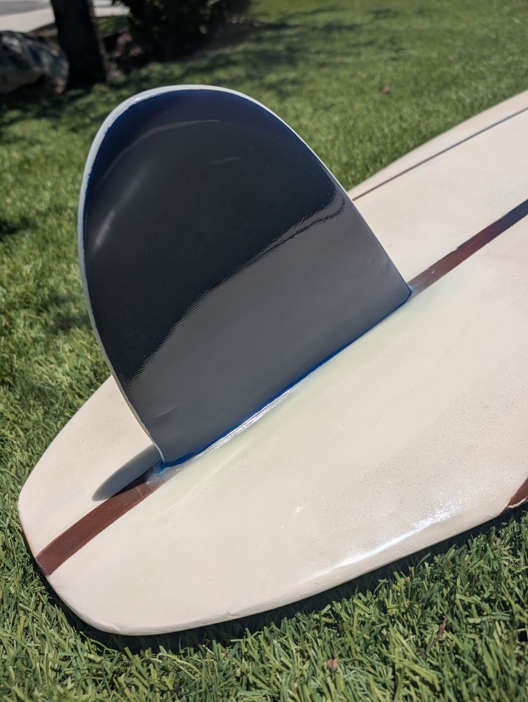 Fin set on the restored longboard
