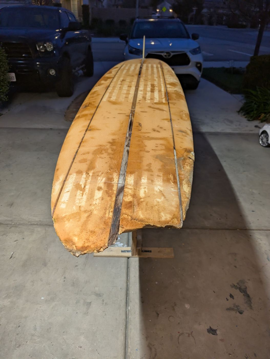 Classic Hobie longboard, sun-rotted and split along the stringer